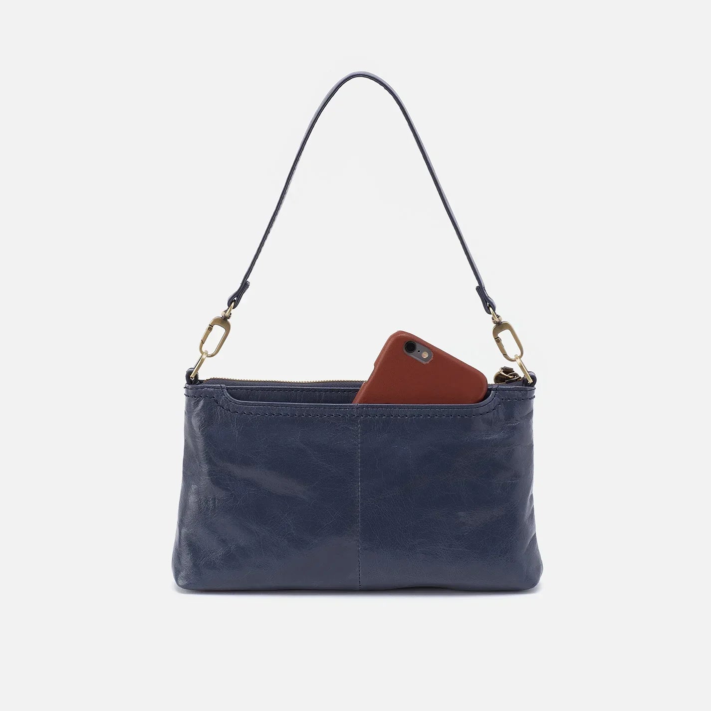 Darcy Crossbody bag designed out of polished leather in the color blue stone. This crossbody is from the handbag brand HOBO.