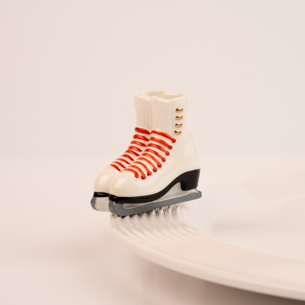 Nora Fleming Rink Ready mini displayed on a serving base (Rink Ready)