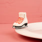 Nora Fleming Rink Ready mini displayed on a serving base (Rink Ready)