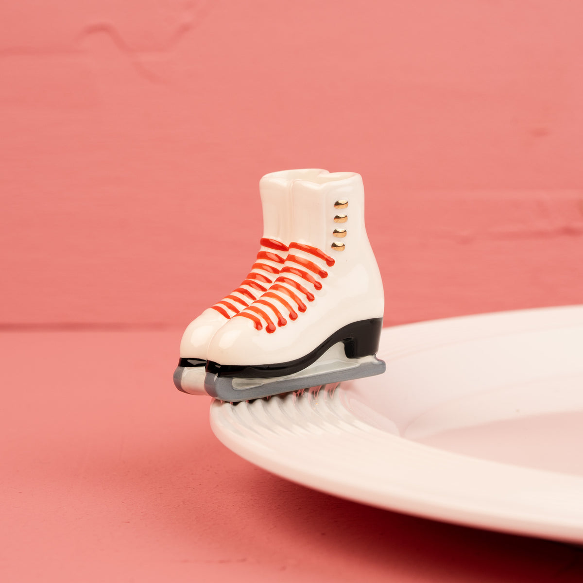 Nora Fleming Rink Ready mini displayed on a serving base (Rink Ready)