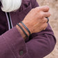 Pig & Hen Catena Foxtail Army Vintage bracelet styled with a burgundy jacket (Army | Vintage)