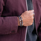 Pig & Hen Catena Foxtail Navy Silver bracelet worn beside a beaded bracelet (Navy | Silver)