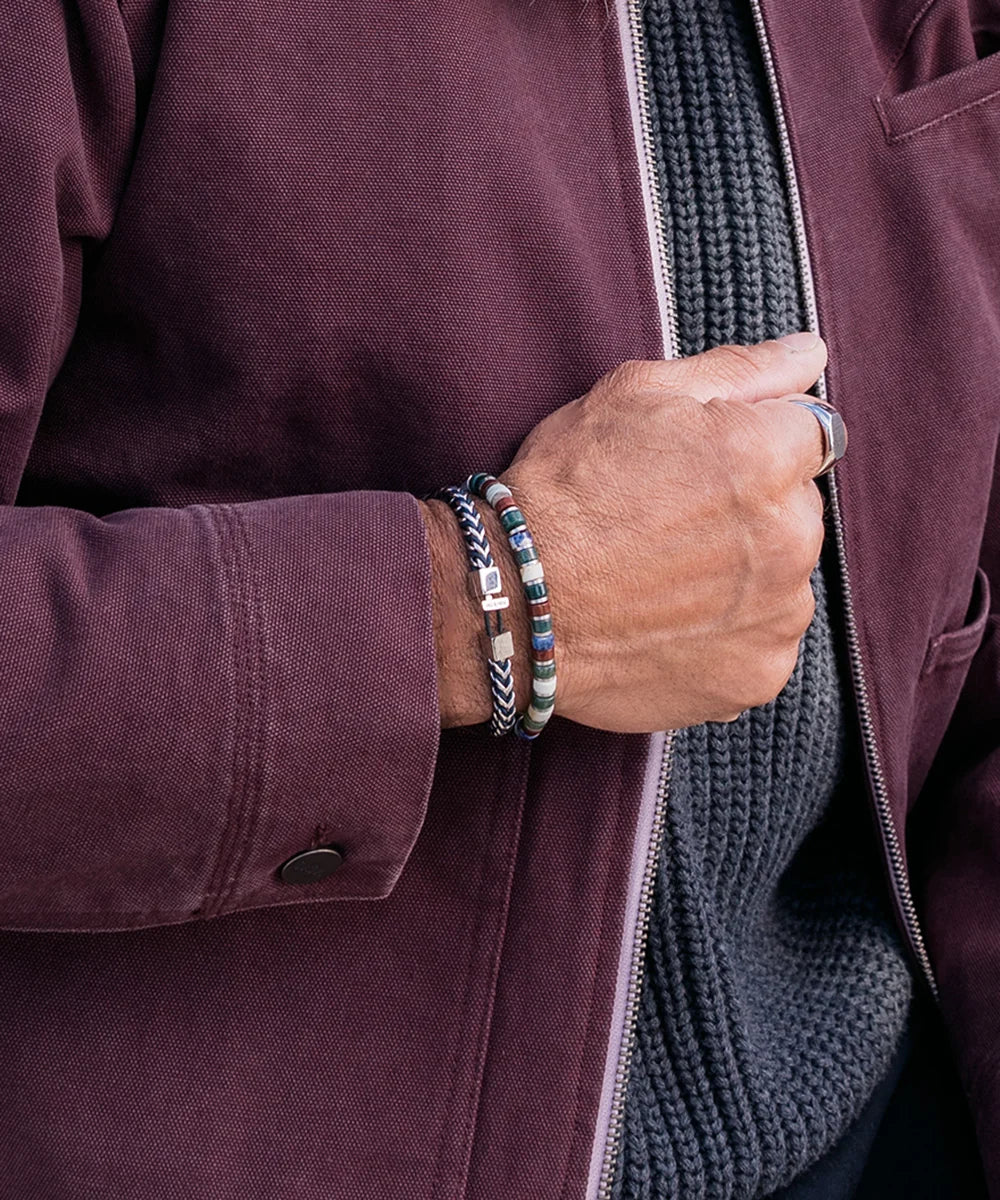 Pig & Hen Catena Foxtail Navy Silver bracelet worn beside a beaded bracelet (Navy | Silver)