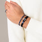 Pig & Hen don dino navy silver bracelet styled on wrist (Navy | Silver)