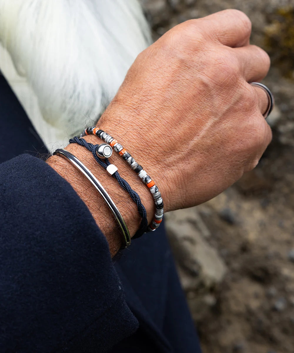 Pig & Hen navarch 4mm closed navy silver bracelet styled on wrist (Navy | Silver)