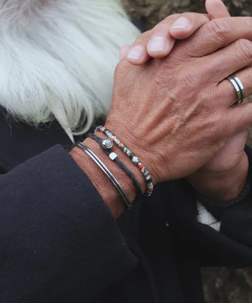Pig & Hen navarch 4mm closed navy silver bracelet styled on wrist (Navy | Silver)