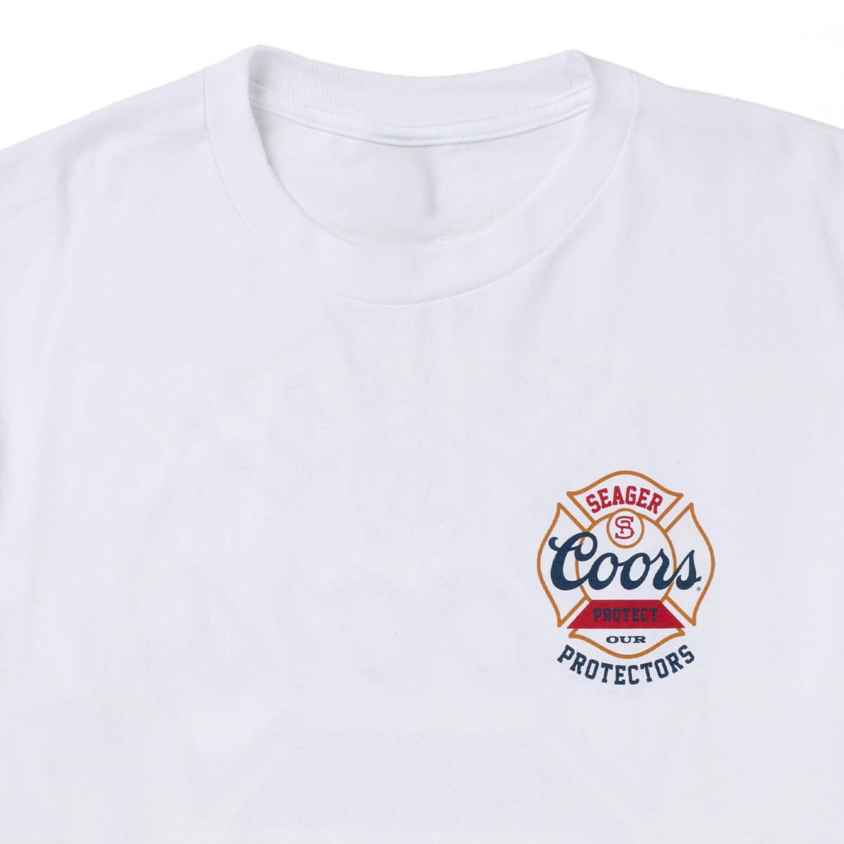 Seager x Coors Protectors Badge Tee in White — chest print detail