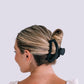 An open jet black hair clip claw from TELETIES.