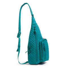 A Vera Bradley Sling Backpack, in Forever Green.
