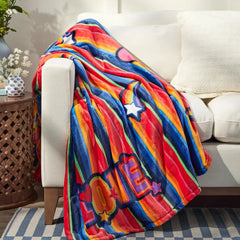 A Vera Bradley Plush Throw Blanket designed in their Pride Love Stripe pattern. With a rainbow design, and the word "LOVE" on the bottom left of the blanket.