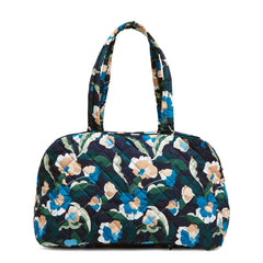 A Weekender Travel Bag in Immersed Blooms pattern.