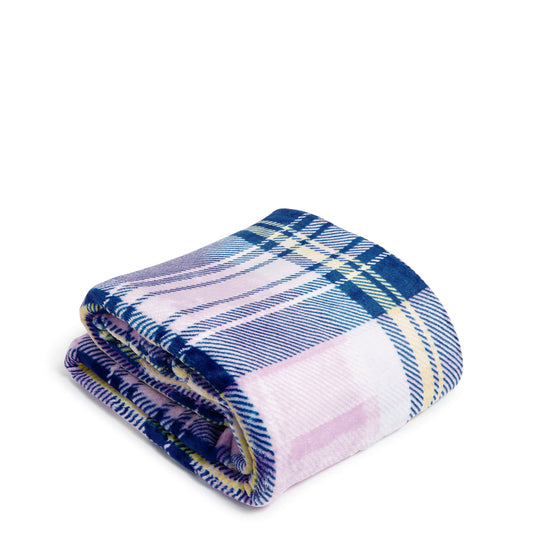A Vera Bradley Plush Throw Blanket In Amethyst Plaid Pattern, folded up neatly. 1230