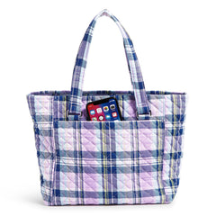 The Vera Bradley Multi-Strap Shoulder Bag In Amethyst Plaid Pattern, back pocket view with an IPhone popping out.