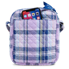 Vera Bradley Small Crossbody Bag In Amethyst Plaid Pattern, showing the back pocket with an iphone popping out of the top.