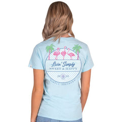 Simply Southern Women's Sweet & Happy Flamingo Short Sleeve Tee on a model, showing the back graphic of the t-shirt. With three pink flamingos.