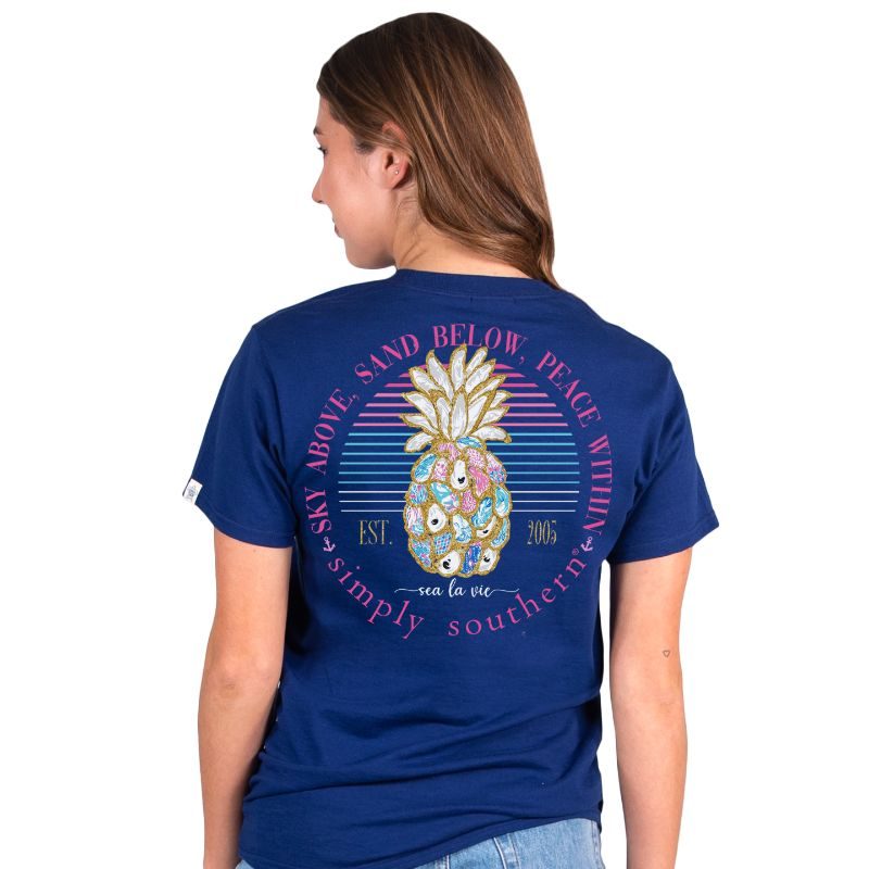 Simply Southern Women's Pineapple Oyster Short Sleeve Tee on a model, showing the back graphic.