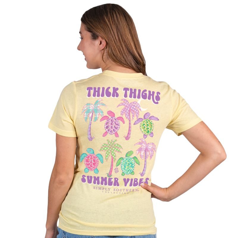 Simply Southern Women's Summer Vibes Short Sleeve Tee on a model, showing the back graphics.