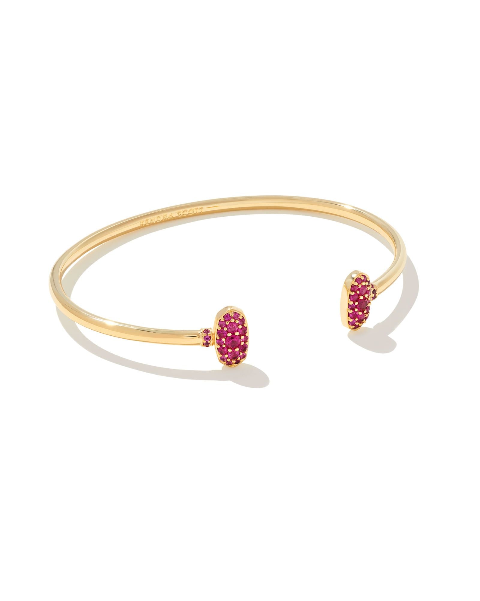 Kendra Scott gold cuff bracelet in ruby crystal