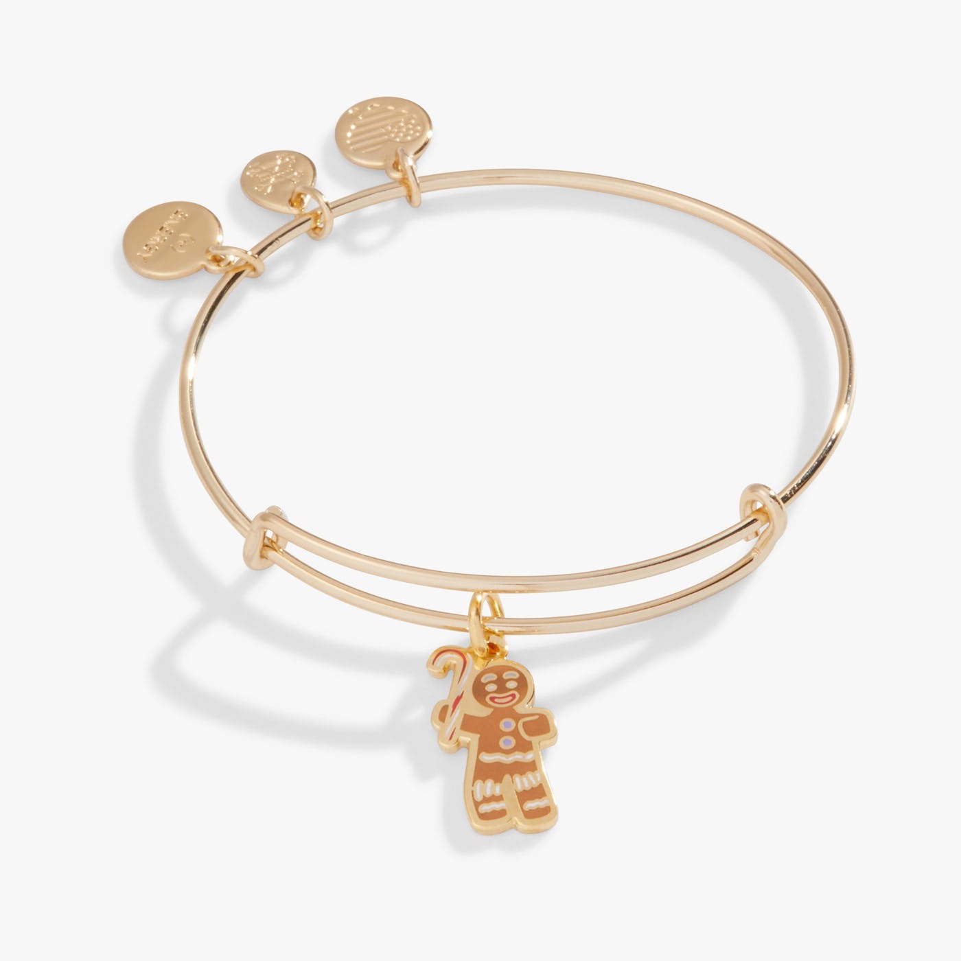 Gold bangle bracelet with a ginger bread man charm.