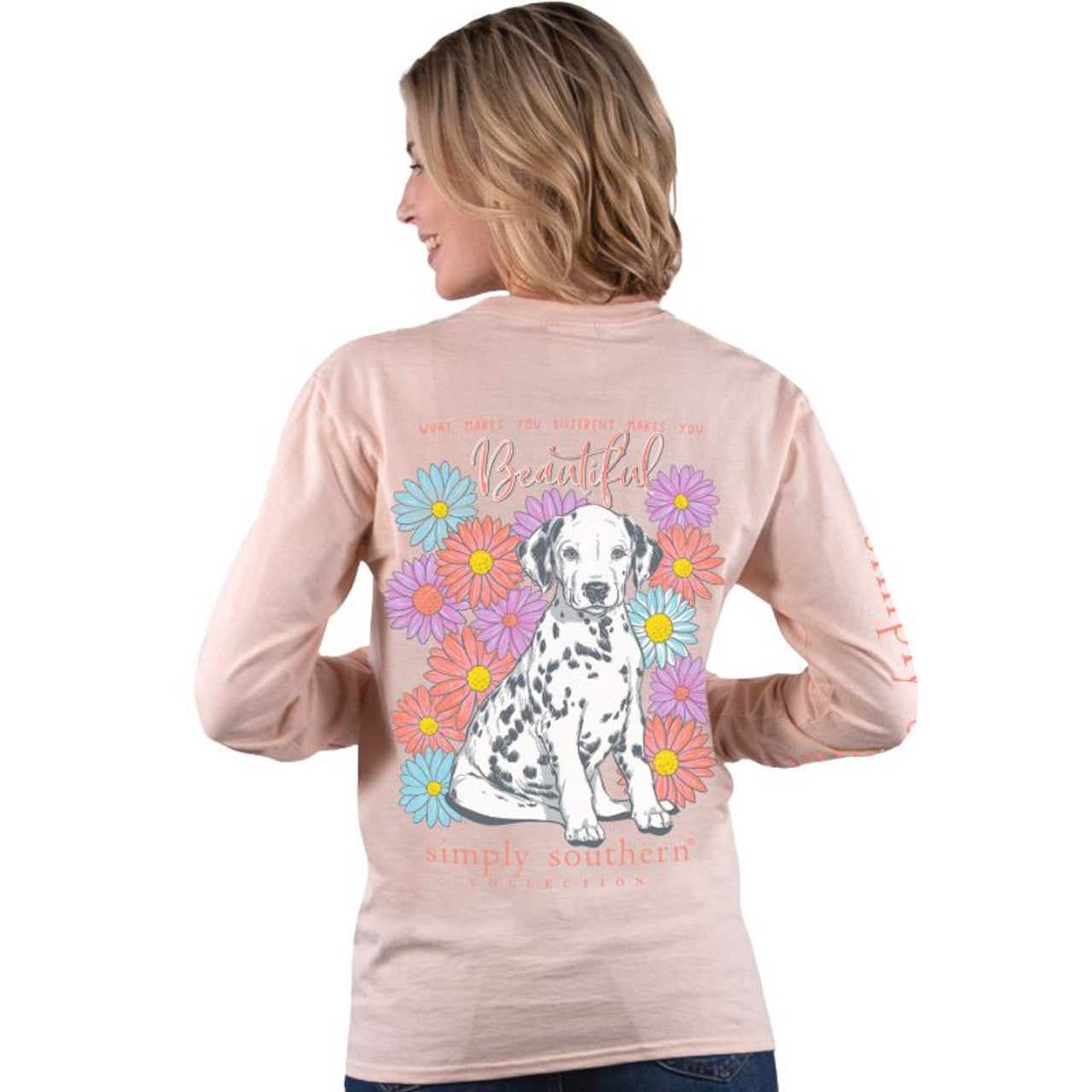 Simply Southern model wearing a long sleeve shirt with a Dalmatian on the back surrounded by flowers.