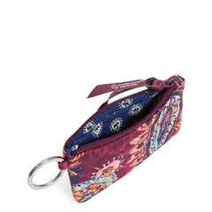 The main zip pocket unzipped, showing a blue interior with a flower pattern.
