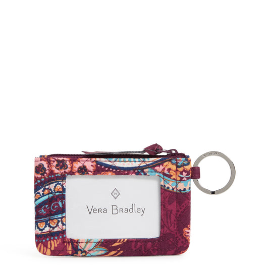 Vera Bradley zip ID case showing a large ID window no the front, with a key ring on the side. 1800